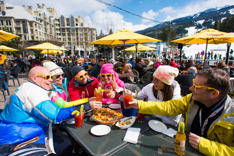 Skiers enjoying a sunny patio in Whistler
